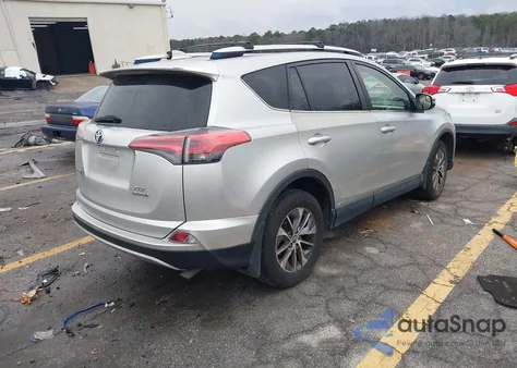 2016 Toyota Rav4 Hybrid Xle z USA, uszkodzony, nr VIN JTMRJREV1GD031063
